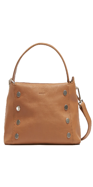 Crafted with neutral tan leather, sourced from Tuscany Red cotton twill lining Brushed silver hardware, covered for life Exterior: Back phone drop pocket Interior: Credit card slot, zip pocket Removable, adjustable shoulder + crossbody straps 9