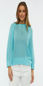 Unleash your unique style with the Zaket & Plover - Holey Top in Aquatic. Made from 100% cozy cotton, this top feature a cool mesh knit pattern and is complemented by a ribbed collar, cuffs, and waistband. Its relaxed fit guarantees comfort and trendiness.