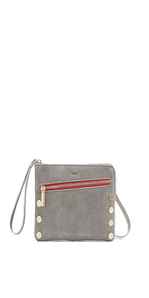 Our Nash Sml is back, complete with our best-loved convertible strap and everyone’s favorite update: An extra top-zipper for easy access.  Crafted with classic pewter leather Red logo twill lining Brushed gold hardware, guaranteed for life Cell phone pocket and flat zippered pocket Removable, adjustable crossbody strap and wristlet 8.25